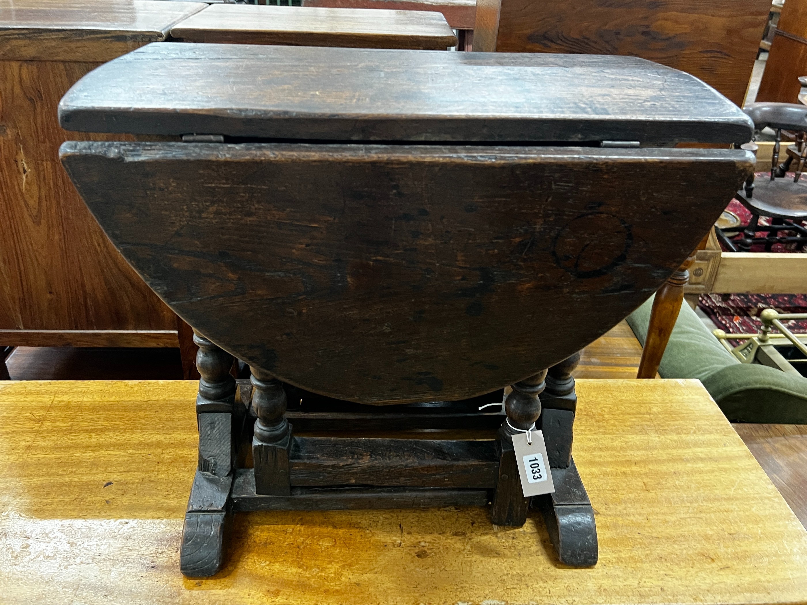 A small 17th century style oak gateleg occasional table, width 61cm, depth 34cm, height 53cm